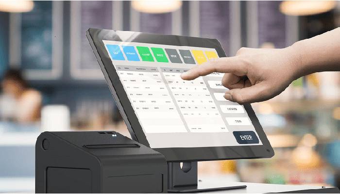 Image of A Person Pointing Out The POS Software
